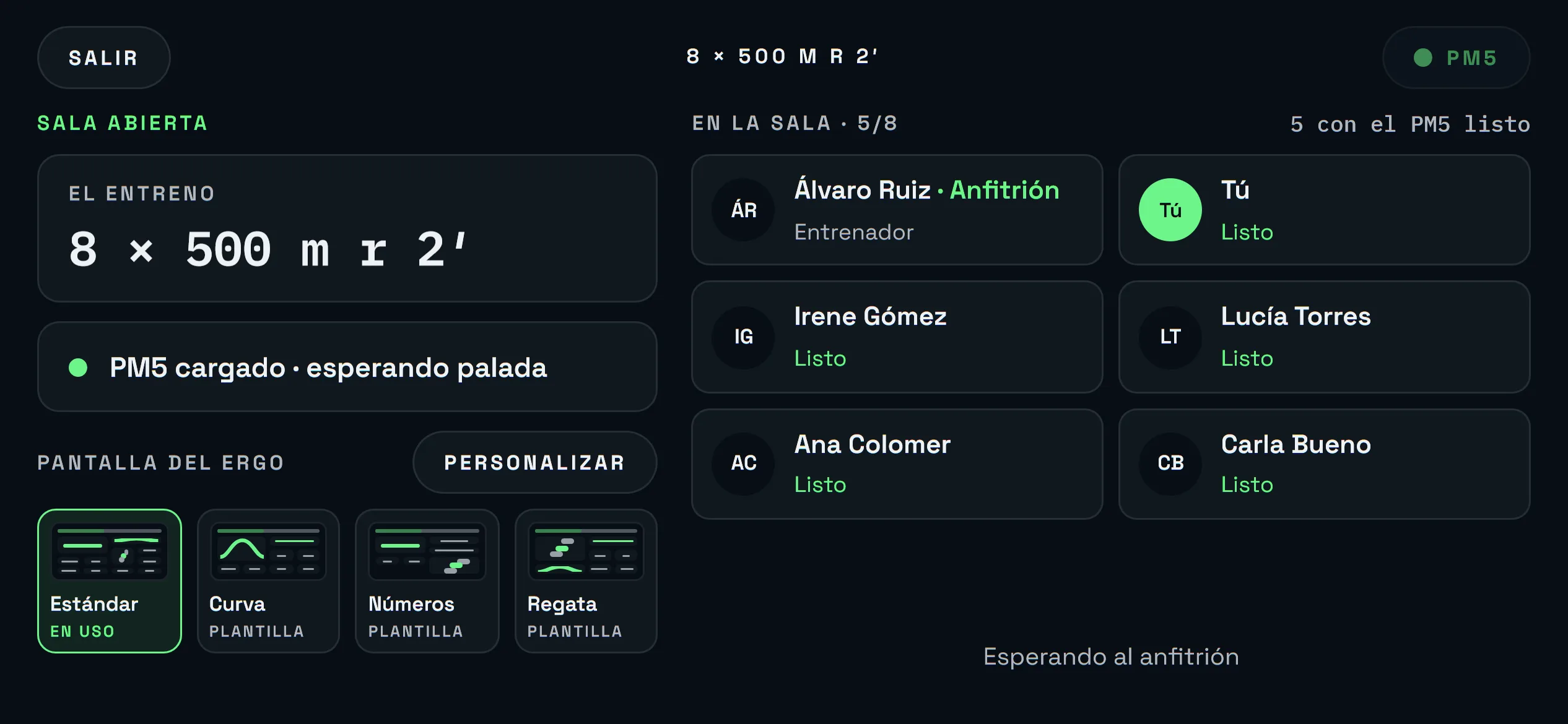 Sala del ergo antes de la salida: el entreno, el PM5 cargado y cinco remeras preparadas, con el entrenador de anfitrión